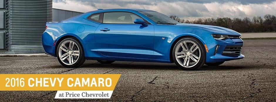 Image of a red 2017 Chevrolet Camaro parked in the middle of the road