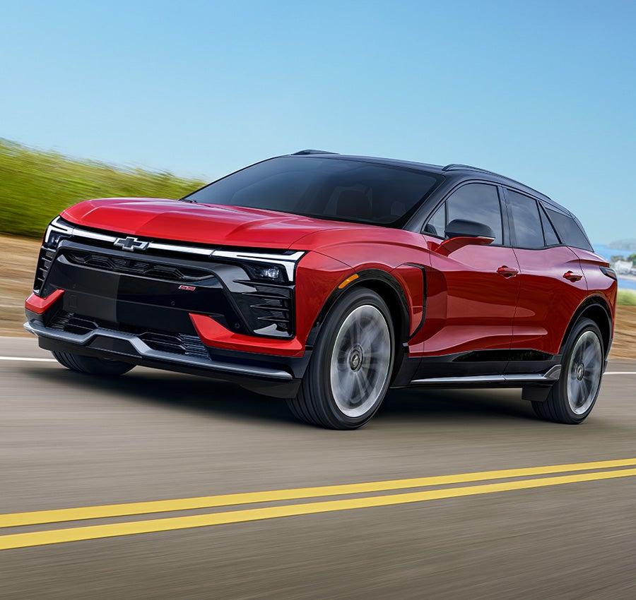 Image of red 2025 Chevrolet Equinox-EV driving
